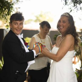 Two elegantly dressed lesbian brides celebrate their union with a ceremony by Perth celebrant Ishara